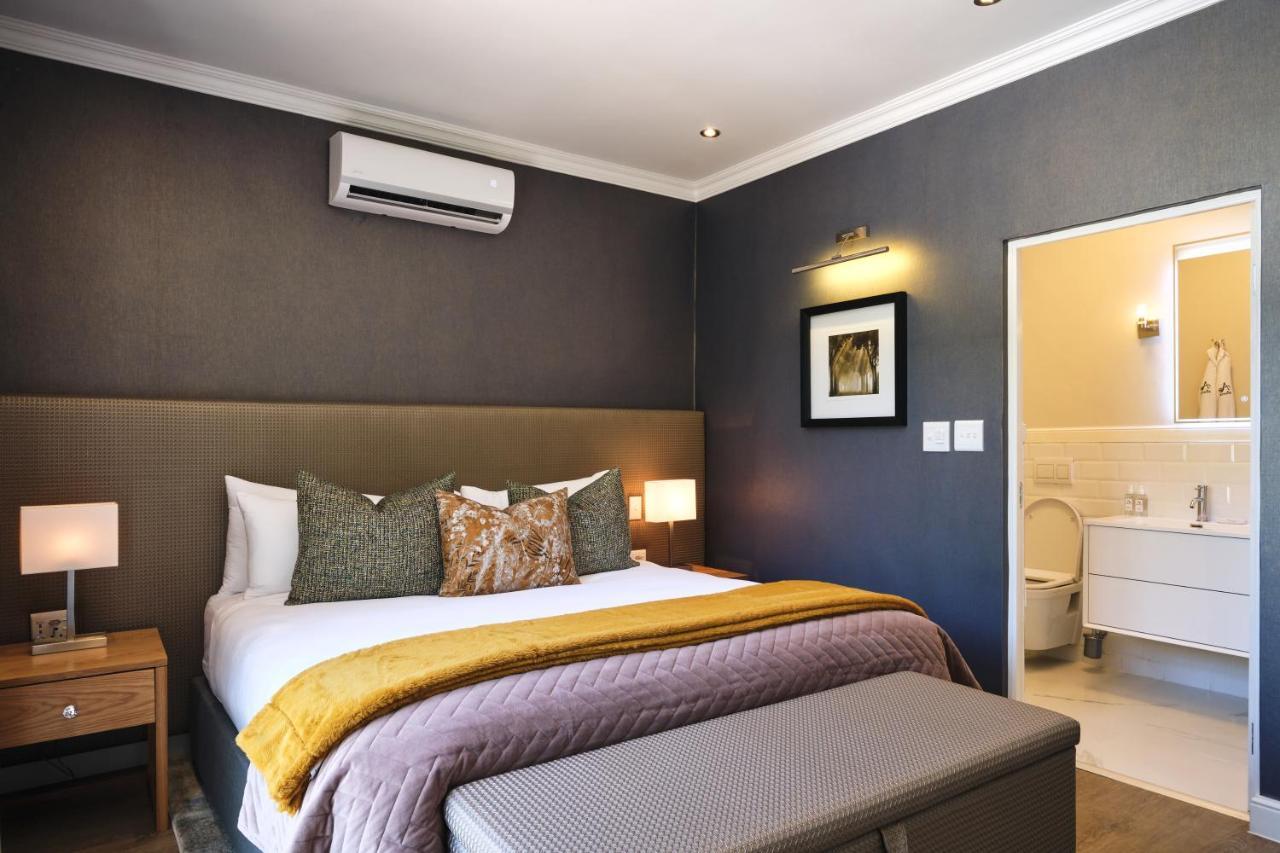Alluvia Boutique Winery & Luxury Accommodation Stellenbosch Exterior photo A bedroom at the Cape Heritage