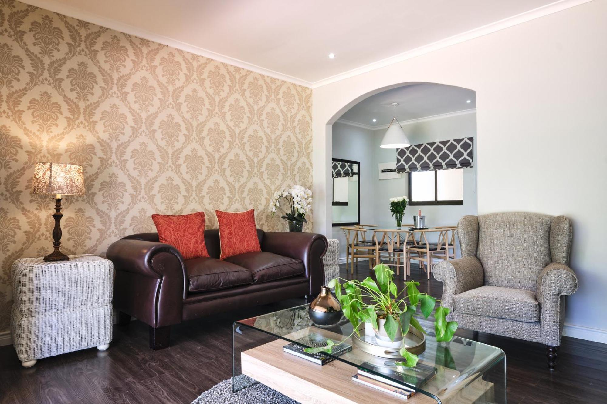Alluvia Boutique Winery & Luxury Accommodation Stellenbosch Room photo A living room with a couch and two armchairs